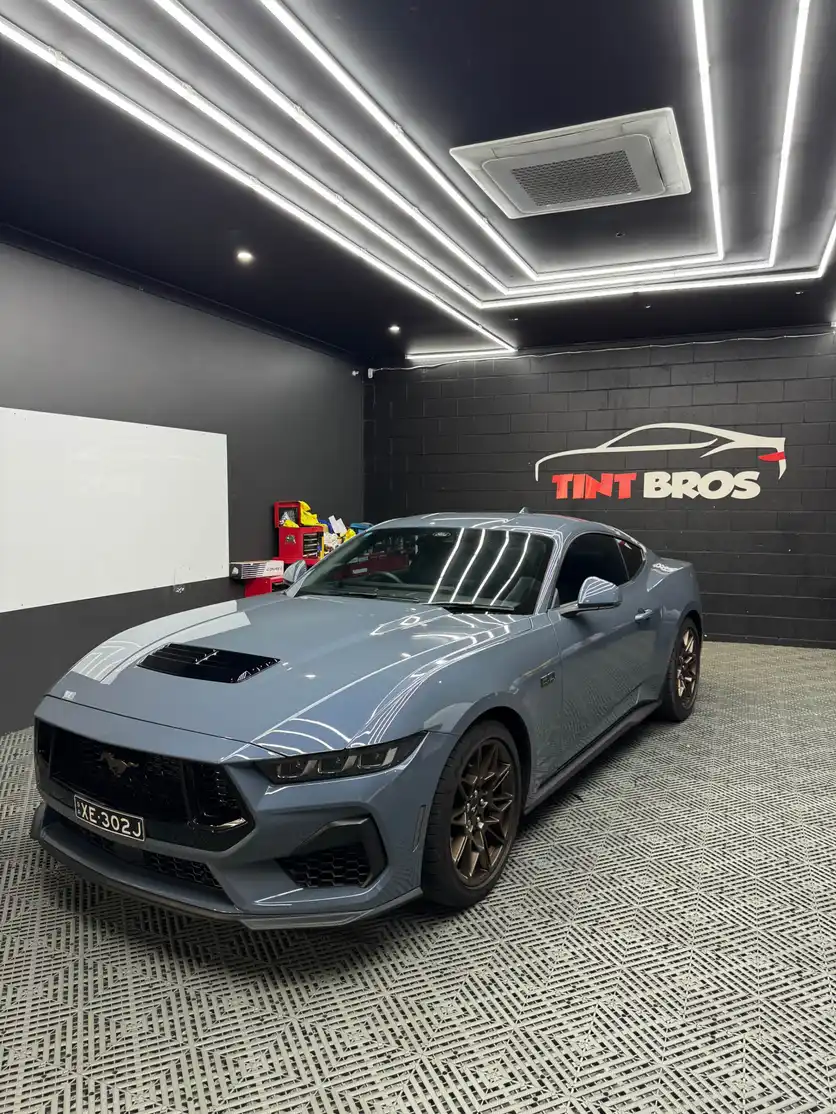 Tint Bros professional window tinting technician at work
