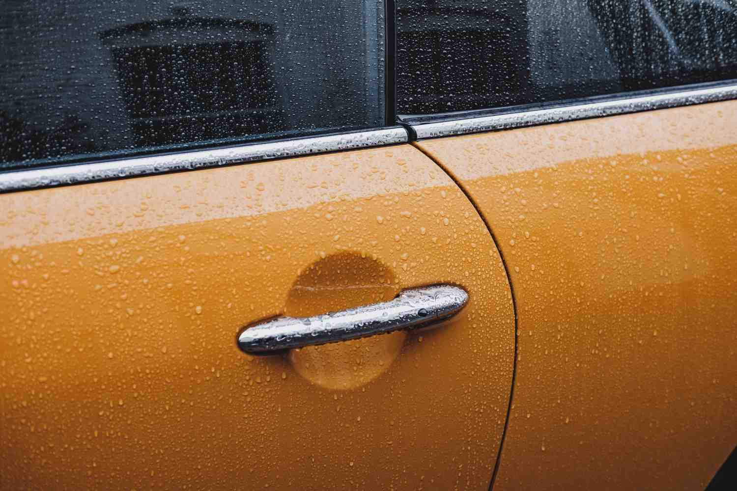 Water beading on a ceramic coated car surface showing the hydrophobic properties of nano ceramic coating applied at Tint Bros Adelaide